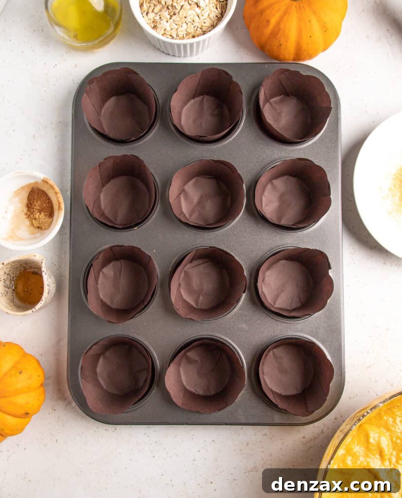 Homemade Pumpkin Muffins from Scratch — Moist Fall Recipe 6 Prepared muffin pan with rustic dark brown paper liners