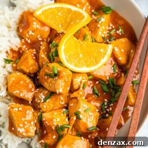 Instant Pot Orange Chicken Recipe: Sticky, Tangy Weeknight Meal 11 Overhead shot of orange chicken on a plate, garnished with an orange twist.