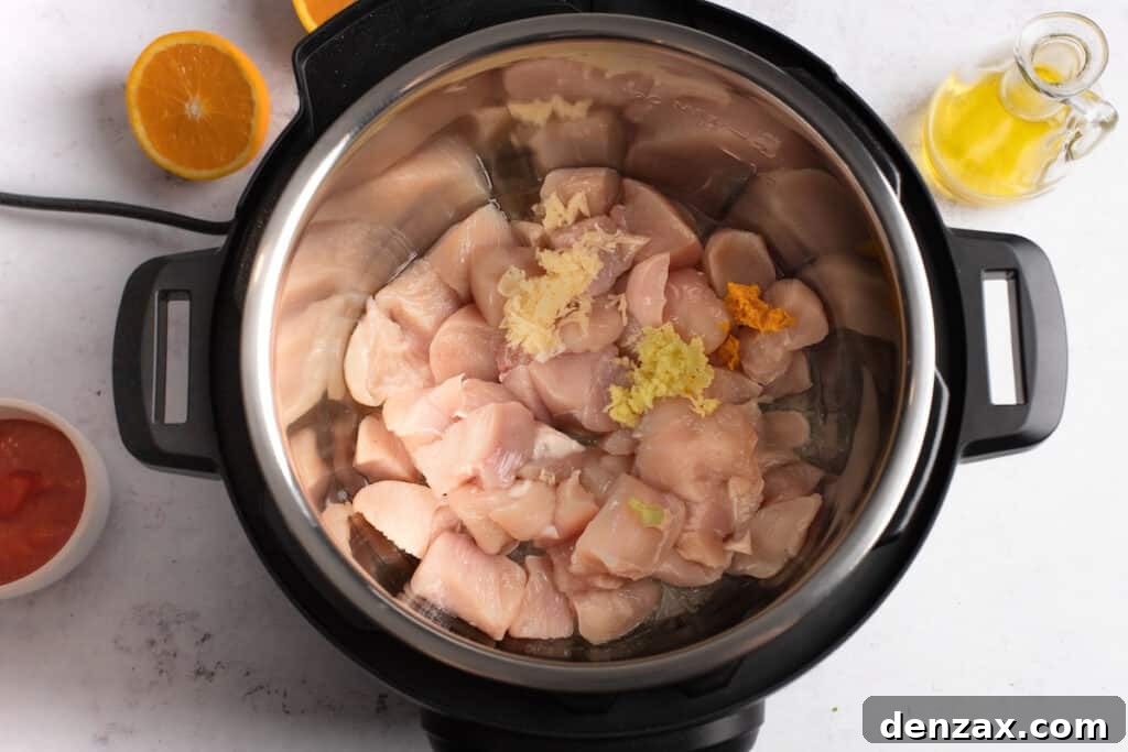 Instant Pot Orange Chicken Recipe: Sticky, Tangy Weeknight Meal 4 Cubed chicken in an Instant Pot.