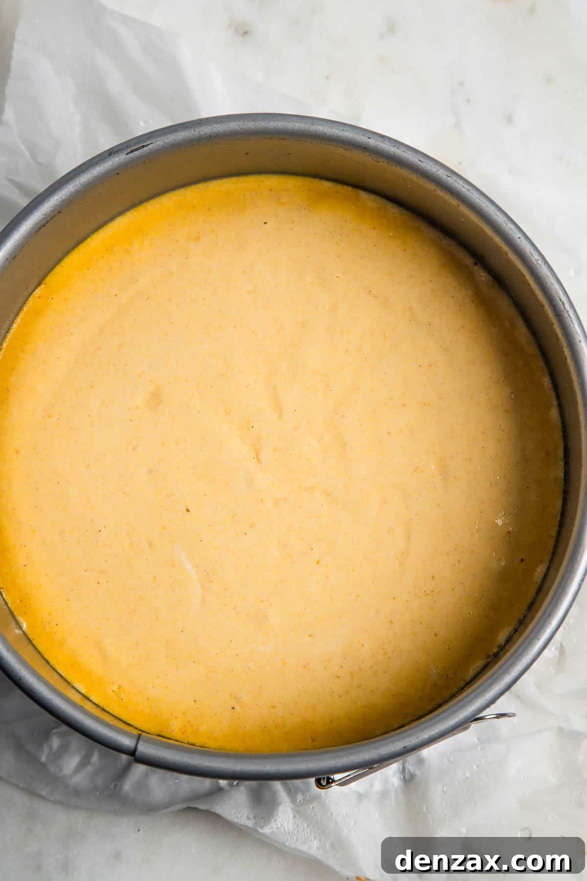 baked pumpkin cheesecake inside an instant pot insert.
