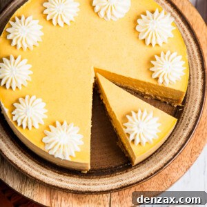 Pumpkin cheesecake decorated with whipped cream.