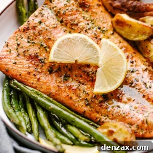 Perfectly Broiled Salmon: Simple Flaky Fillet Recipe 2 Broiled salmon plated with potatoes and greenbeans and garnished with lemon wedges
