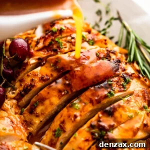 pouring gravy over sliced turkey breast