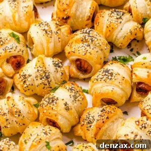 Close up shot of crescent roll hot dogs sprinkled with sesame and poppy seeds.