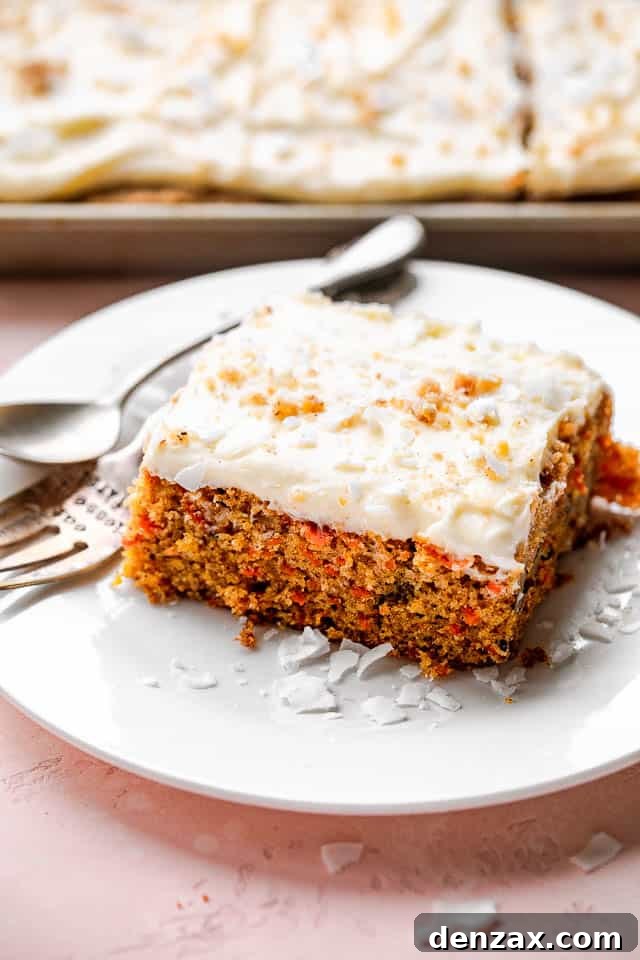 A slice of carrot cake on a white plate.