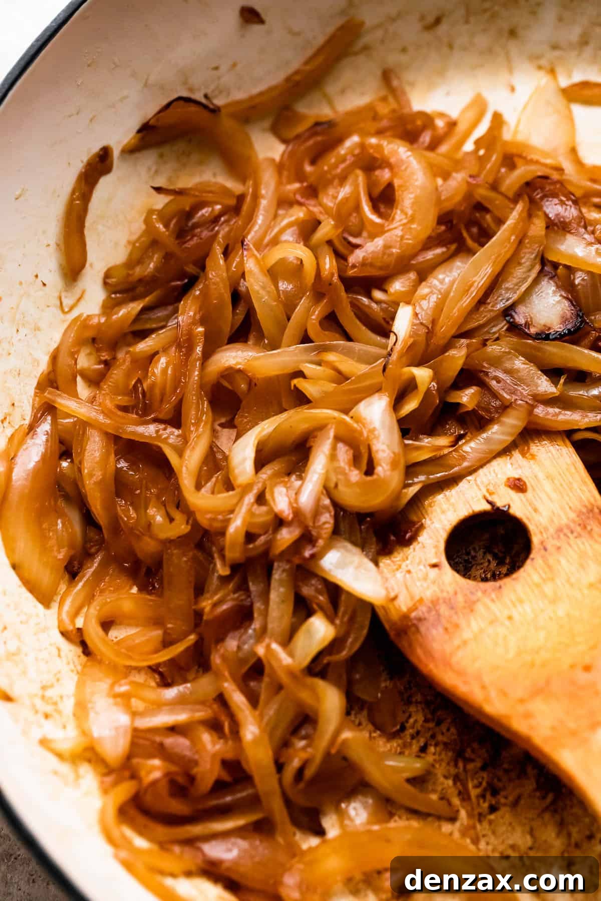 cooking thinly sliced onions in a skillet.