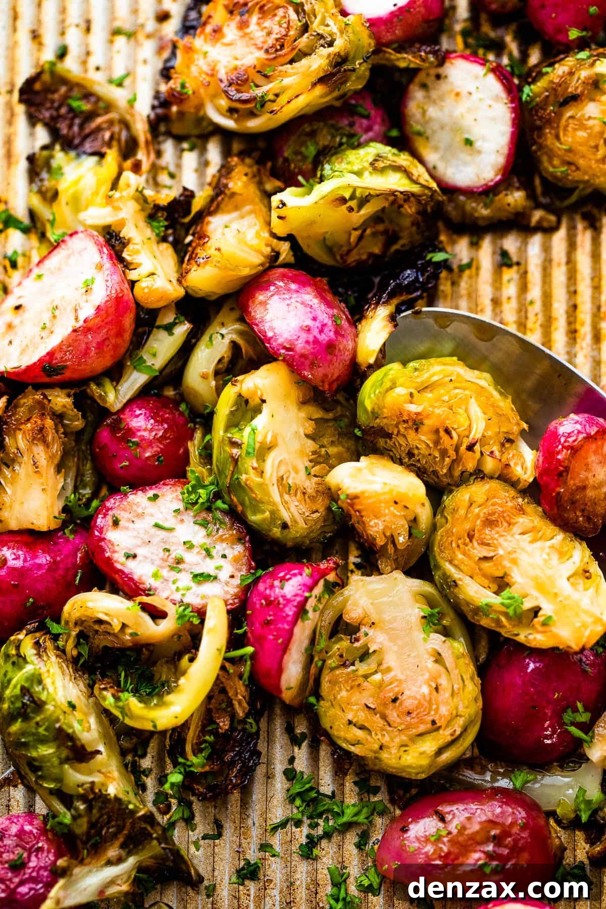 Crispy Roasted Brussels Sprouts with Caramelized Radishes 2 Close up shot of halved Roasted Brussels Sprouts and Radishes on a baking sheet
