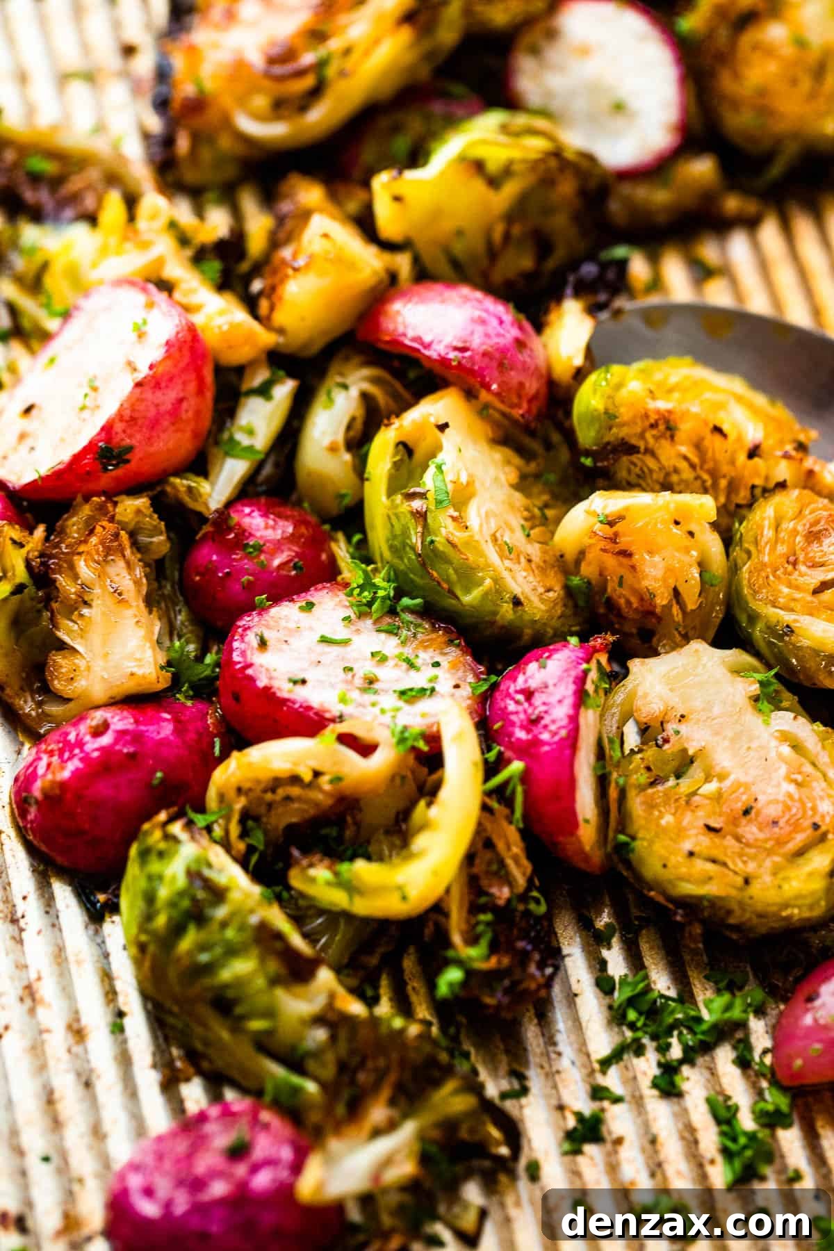 Crispy Roasted Brussels Sprouts with Caramelized Radishes 6 Close up shot of halved Roasted Brussels Sprouts and Radishes on a baking sheet