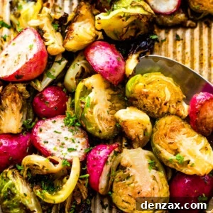 Crispy Roasted Brussels Sprouts with Caramelized Radishes 7 Close up shot of halved Roasted Brussels Sprouts and Radishes on a baking sheet